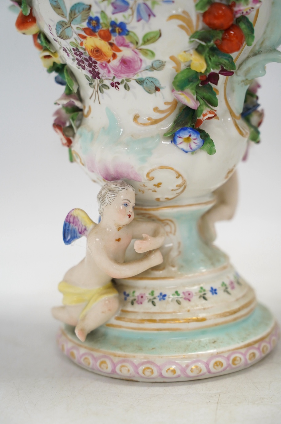 A pair of Potschappel porcelain floral encrusted vases and covers, 31cm high. Condition - poor